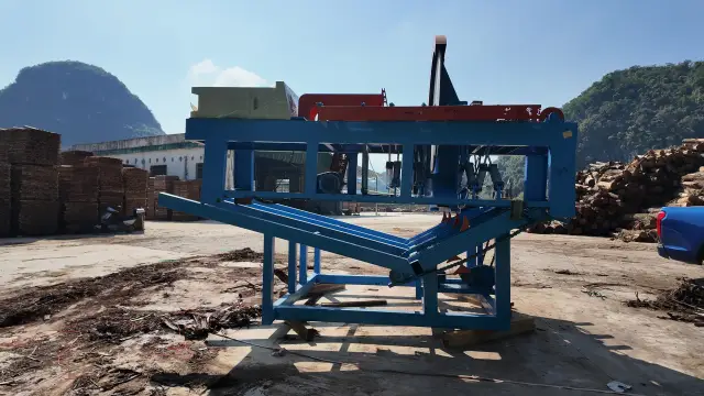 LW-CS1200P cut-off saw outdoors at the customer site in Guangxi, log stacks behind